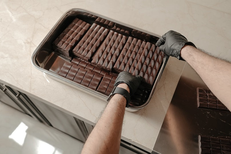 Rolling Hills chocolate bars being hand-packed in foil